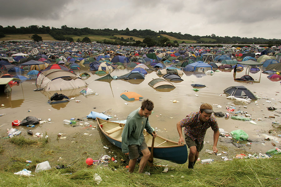 A file photo of flooded tents after a month's worth of water fell over the festival site in just a few hours in 2005 at the Glastonbury Fest site.